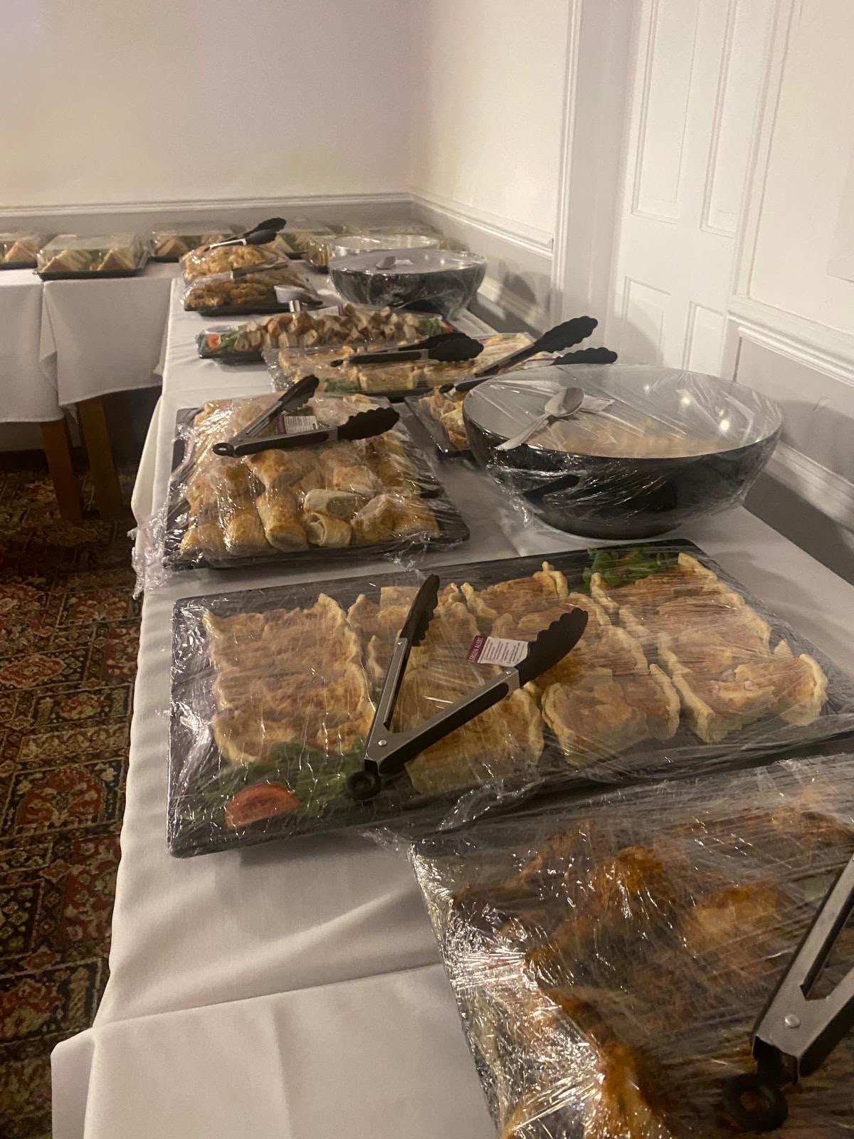 A buffet and seating arrangement inside The EKCO Club